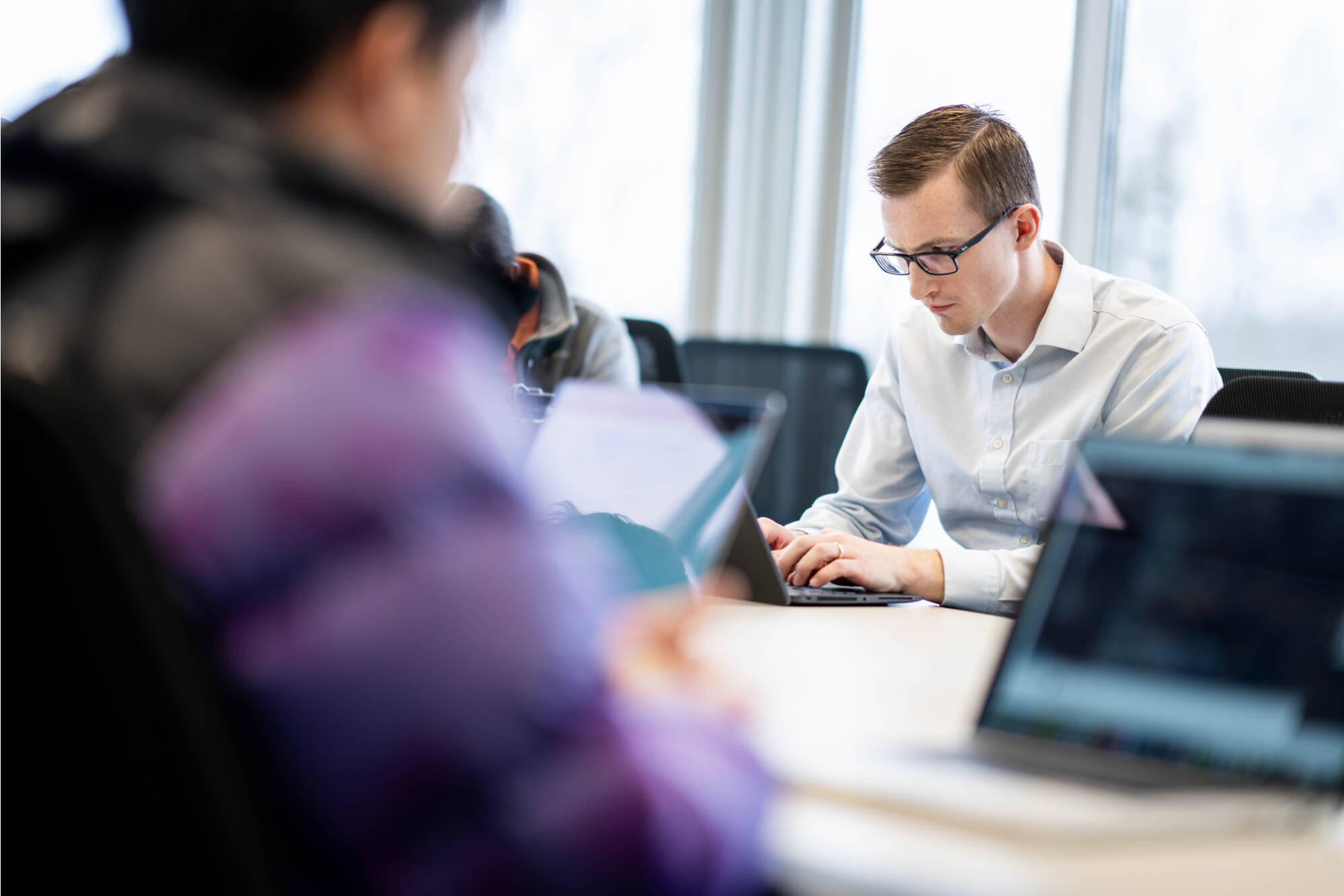 person looking at computer and typing